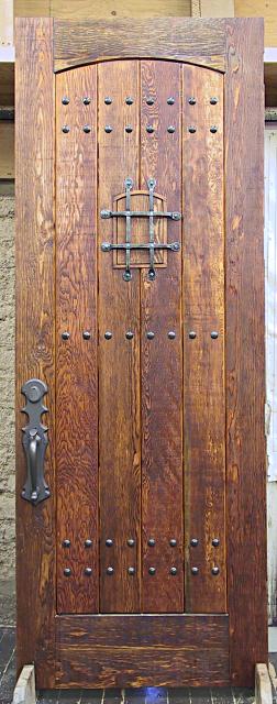 Rustic fir door with speakeasy