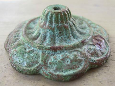 bronze rosette with verde patina