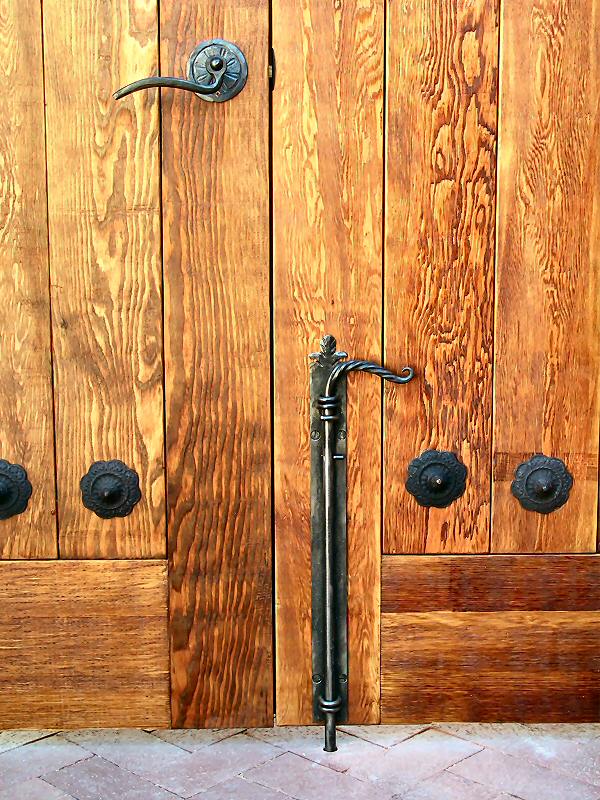 Closeup of wrought iron hardware and rosettes