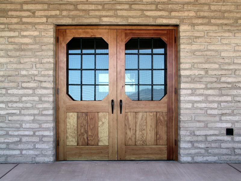 Rustic courtyard gates with rosettes