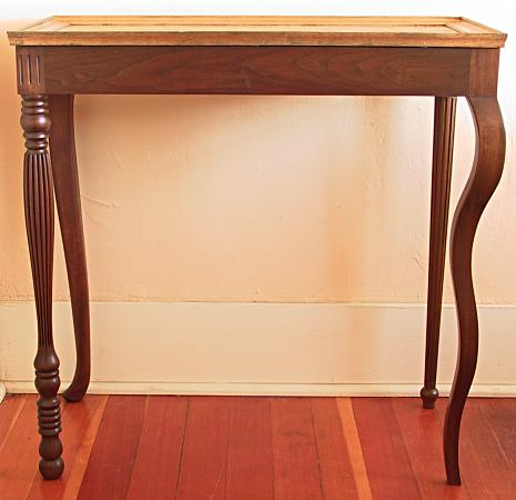 Eclectic table with four different legs