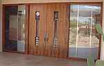 Mesquite veneered doors with hand blown glass