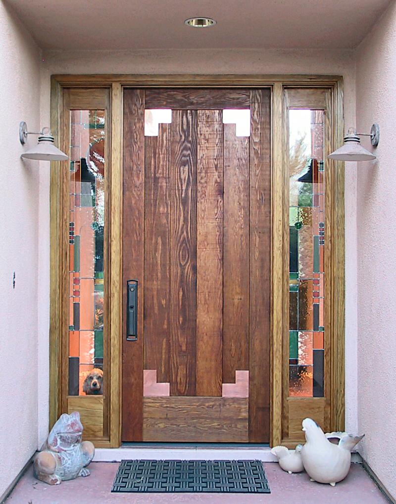 Rustic entry door with copper corners