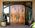 Arched mesquite doors in ebonized frame